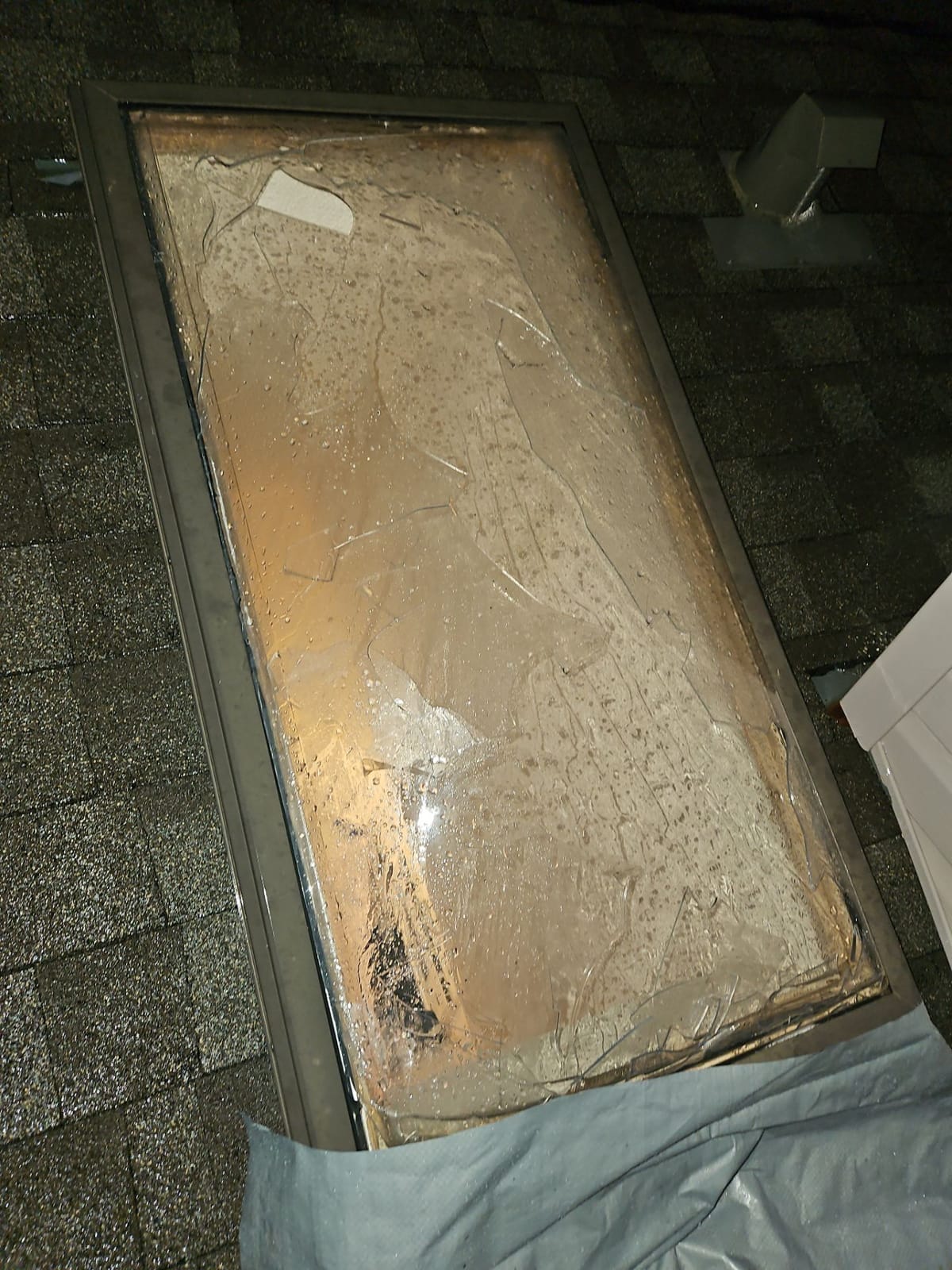 close up view from a hail damaged skylight in Calgary