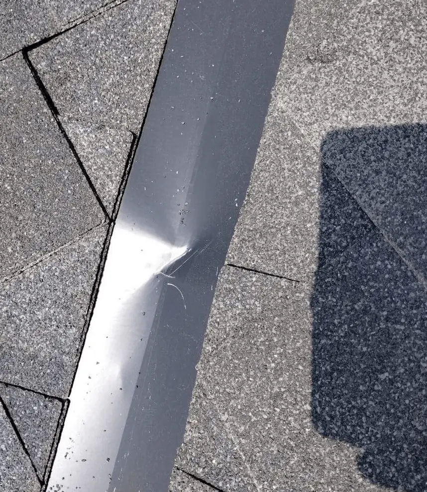crocked metal roof valley caused during coil delivery or post-installation tool movement
