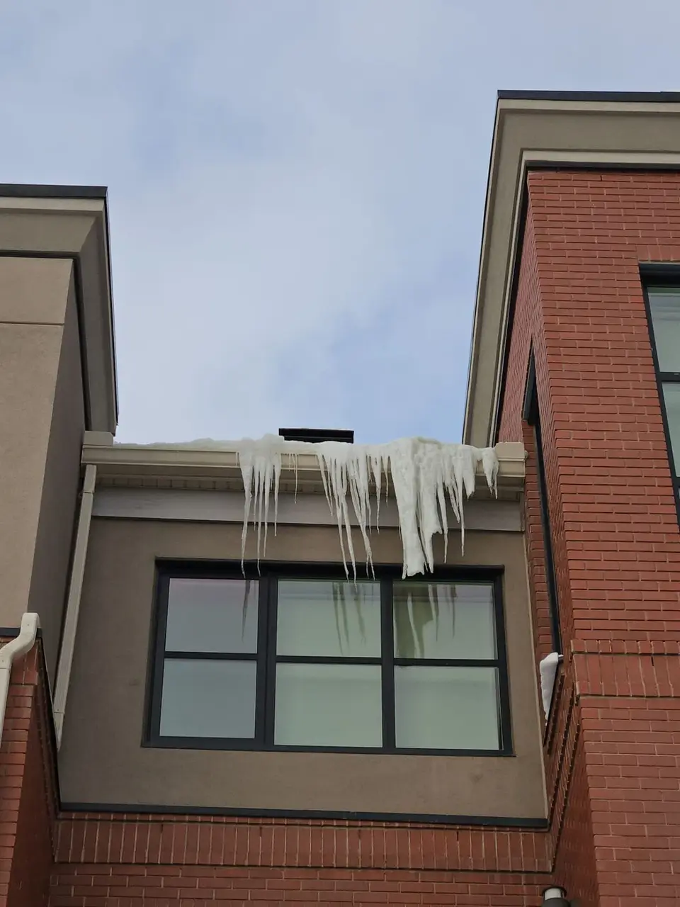 ice damming on a building Aspen MEadows Hill SW