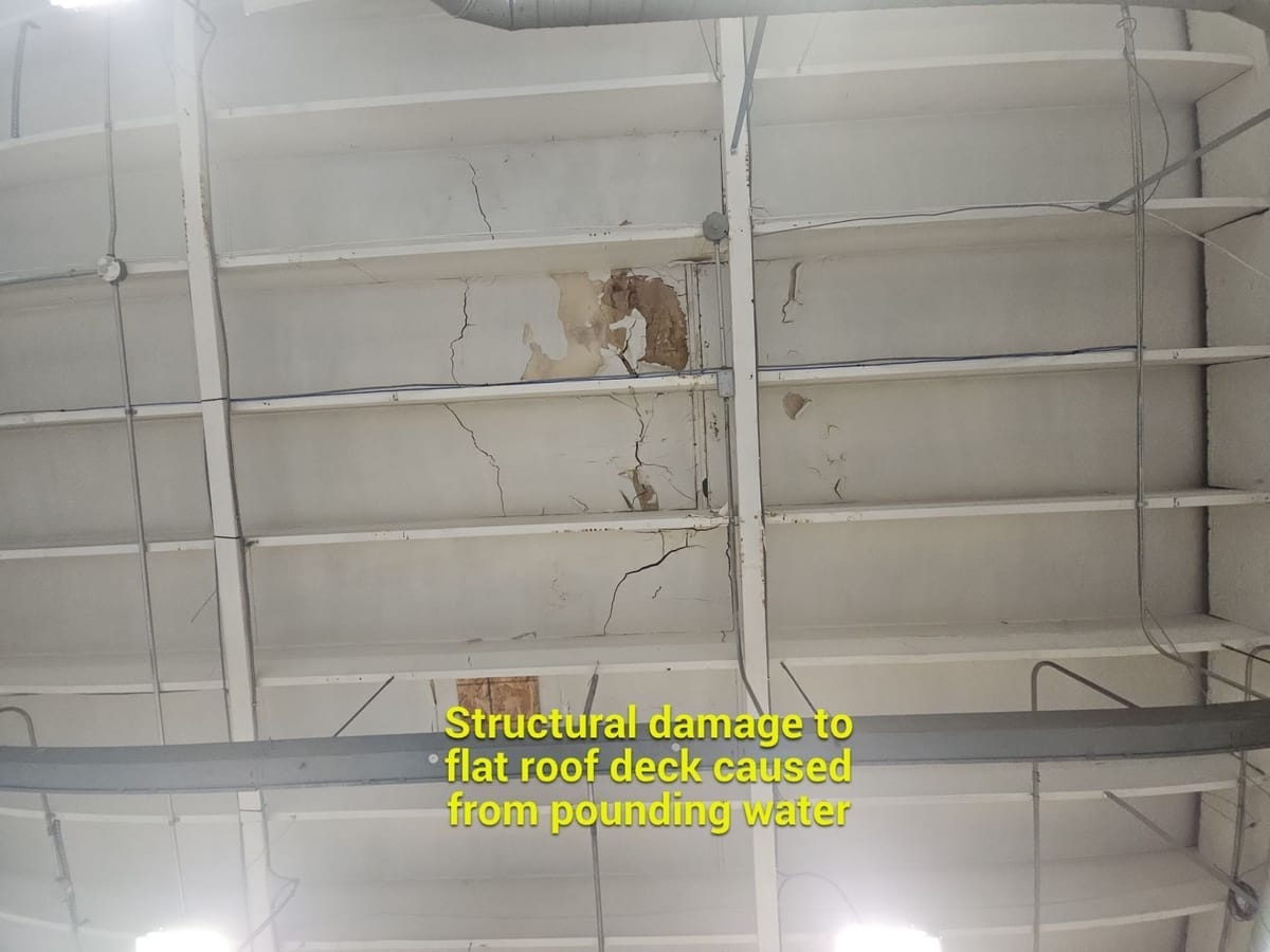 structural damage to flat roof deck from pounding water caused by insufficient slope