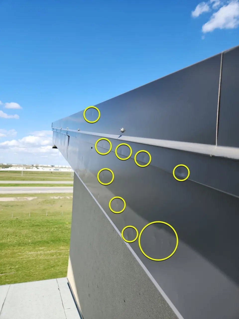 Dents to parapet wall flashing