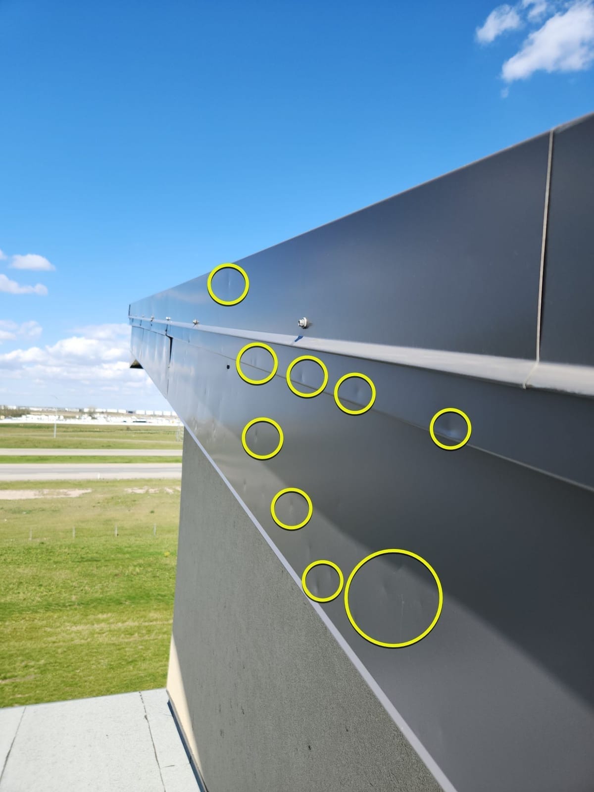 Dents to parapet wall flashing