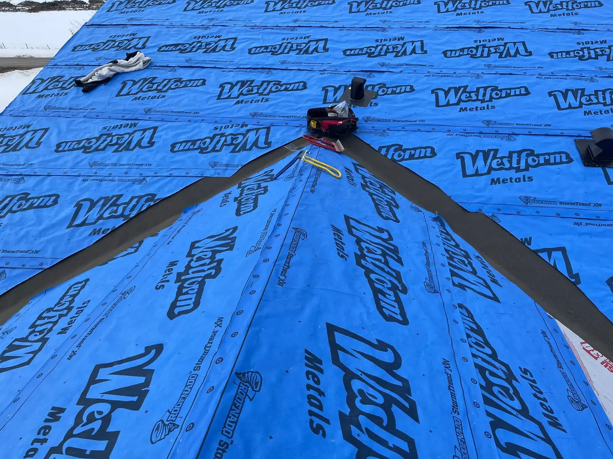 Westform metals underlayment, ice and water shield in valleys before installing metal roof in Alberta