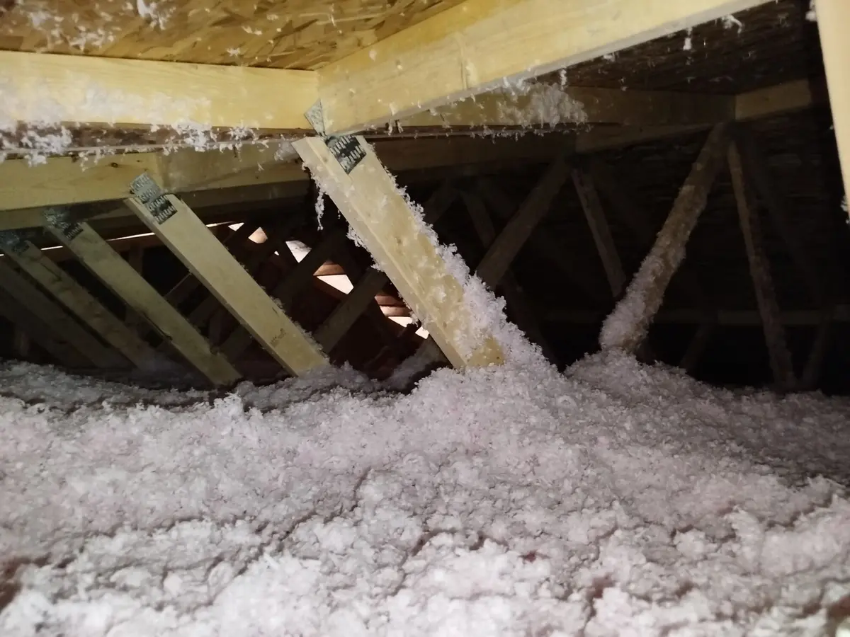 View of attic roof, completed blow-in insulation in Calgary