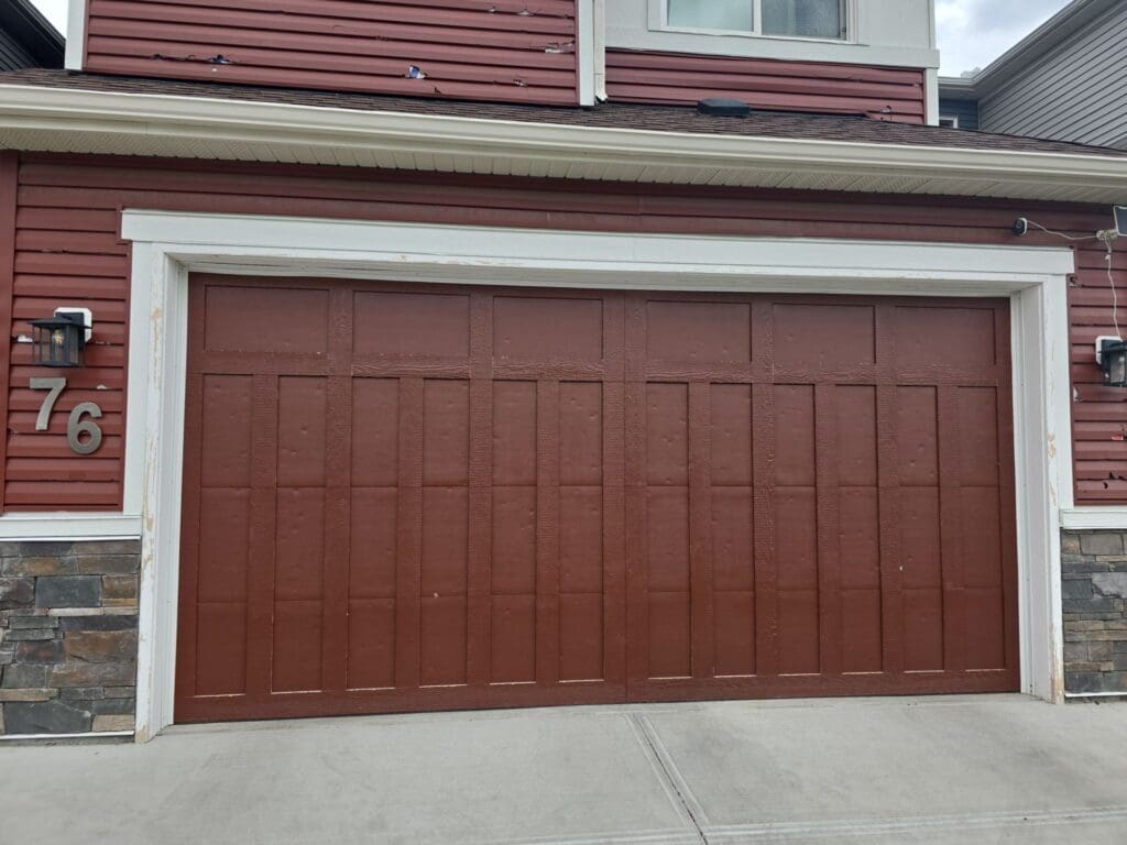 Solid dents to garage door