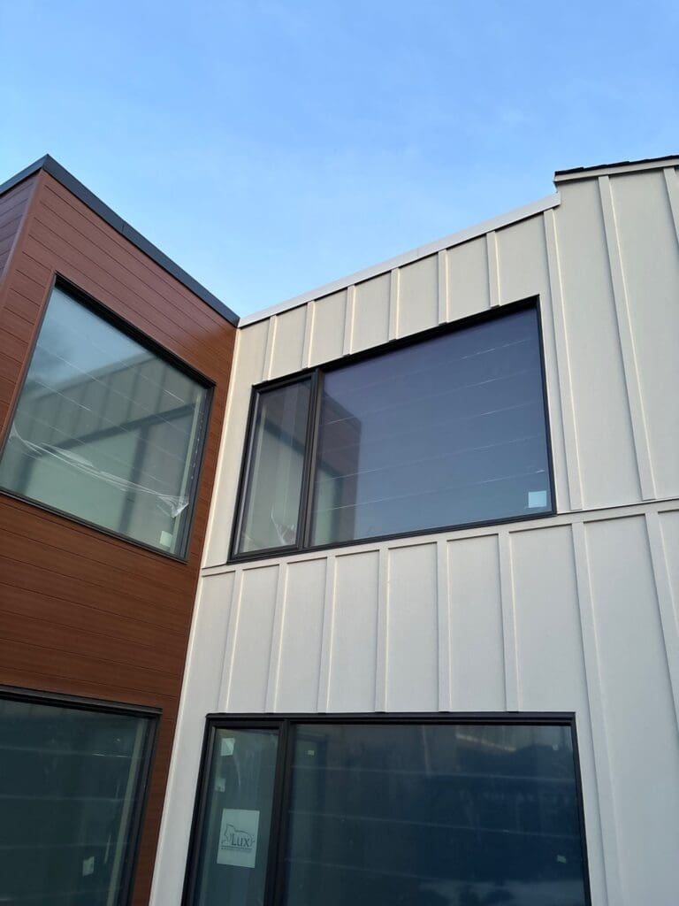 exterior-renovation-in-bel-aire-calgary White board and batten and brown LuxV planks seamlessly used as wall cladding in a renovation project 2.2mm in Bel Aire Calgary