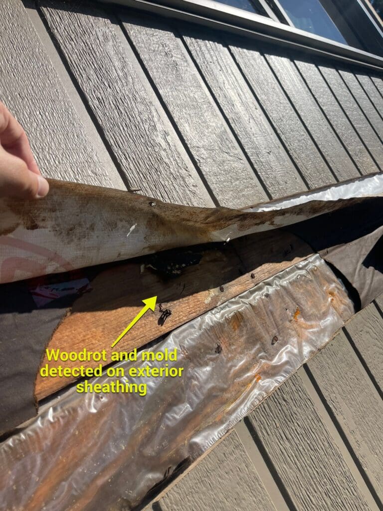 woodrot-mold-exterior-wall-sheathing-bel-aire-calgary image showing removed wooden siding to inspect woodrot and mold to exterior wall sheathing at 67 Bel-Aire Pl SW Calgary, AB T2V 2C3